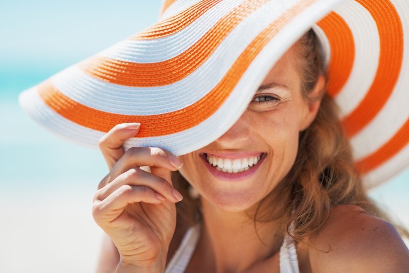 smiling woman in a beach hat